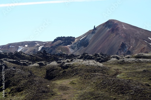 View over barren plain on rugged black volcanic hill - Landmannalaugar, Iceland