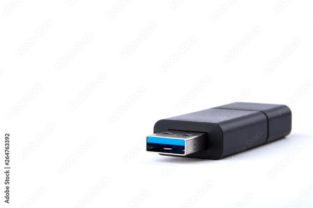 Detailed view of black USB flash drive with silver blue connector. On white background with space for your text.