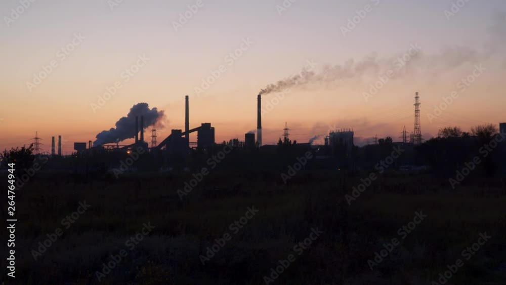 Smoke from the pipes against the sky at sunrise. Smoke from the pipes against the sky at sunrise.