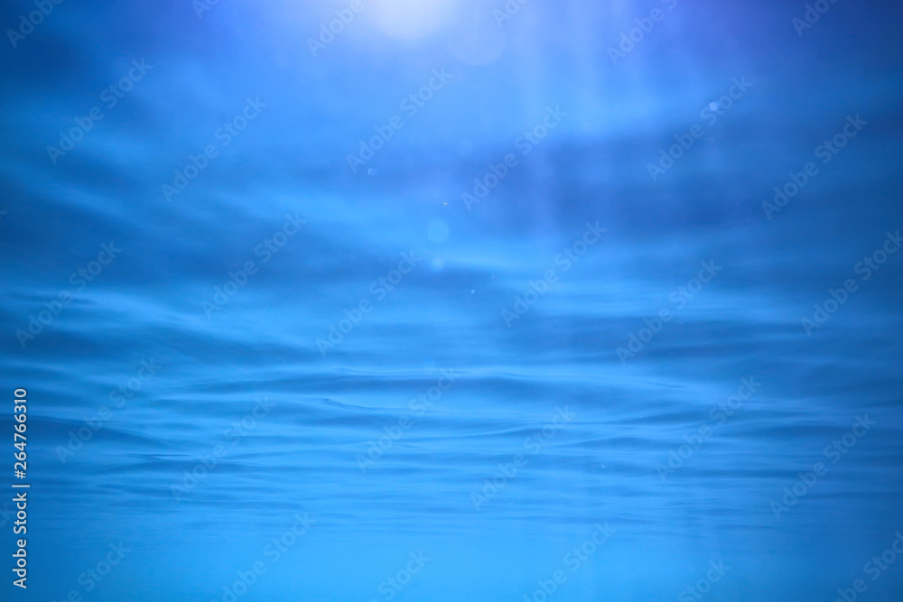 ocean water blue background underwater rays sun / abstract blue background nature water ocean water blue background underwater rays sun / abstract blue background nature water