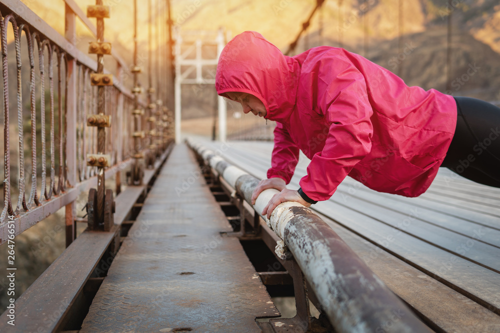 Shot of an adult athletics woman working out in the morning. Shot of an adult athletics woman working out in the morning.