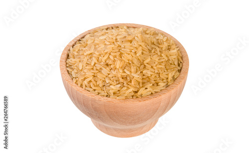 brown rice in wooden bowl isolated on white background. nutrition. food ingredient.