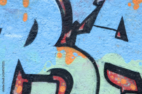 Fragment of colored street art graffiti paintings with contours and shading close up photo