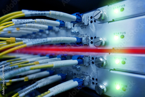 Fiber Optical connect to interface. Telecommunication Cables Connected Working Switch In Data Center.