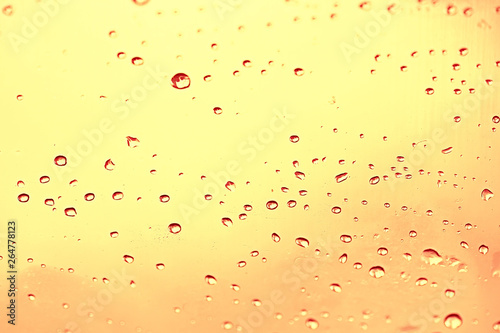 yellow tinted glass drops / abstract background texture