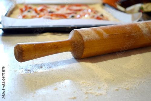 Rolling pin and dough. Making Pizza. 