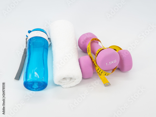 Fitness equipment with dumbbells, drinking water bottle and towel isolated on a white background. Healthy with exercise concept.