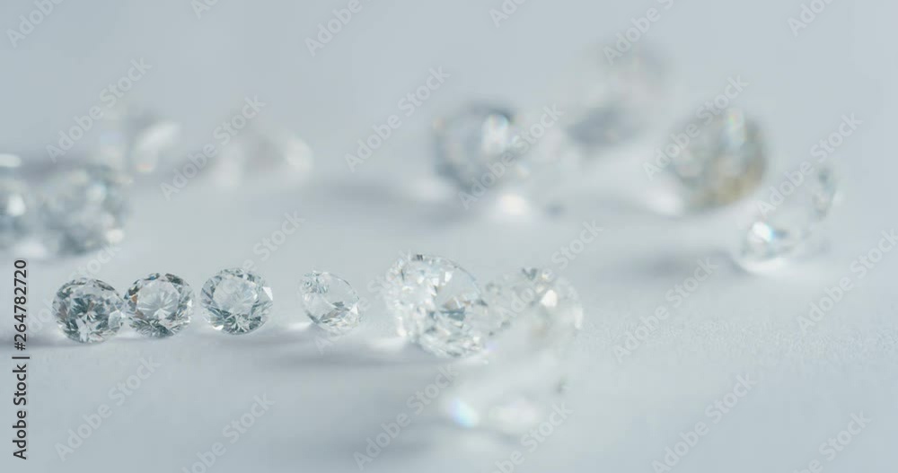 Slow motion macro of experienced goldsmith sorting high quality diamonds, selecting them to make precious jewels in workshop. Shot in 8K. Concept of jewelry,luxury,goldsmith, diamonds, brilliance. Slow motion macro of experienced goldsmith sorting high quality diamonds, selecting them to make precious jewels in workshop. Shot in 8K. Concept of jewelry,luxury,goldsmith, diamonds, brilliance.