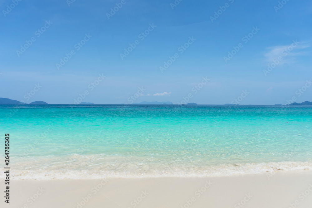 Beautiful turquoise water, white sand beach and clearly blue sky during day time.