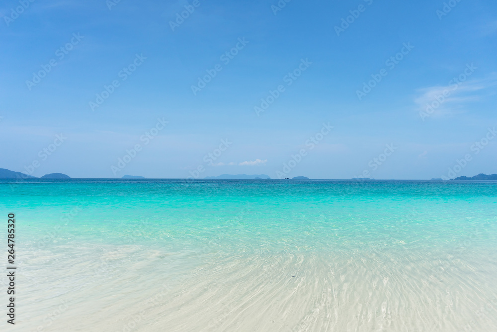 Beautiful turquoise water, white sand beach and clearly blue sky during day time.