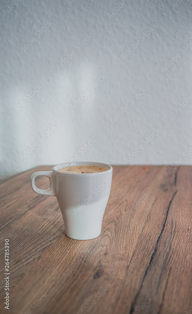 White up of coffe on wooden table, selected focus White up of coffe on wooden table, selected focus