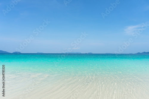 Beautiful turquoise water  white sand beach and clearly blue sky during day time.