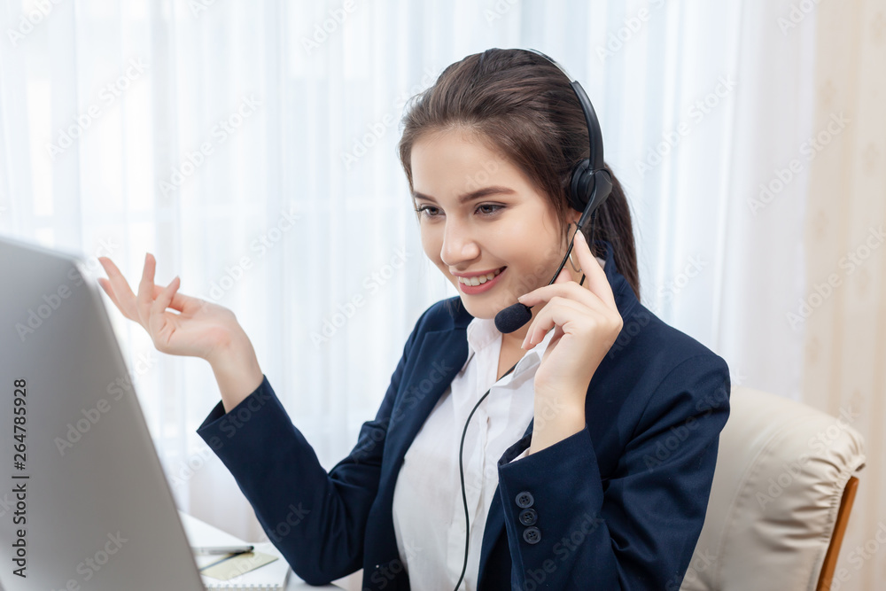 Call center worker. Smiling operator woman with headset and computer at office.
