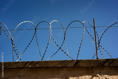 Barbed wire on a stone fence