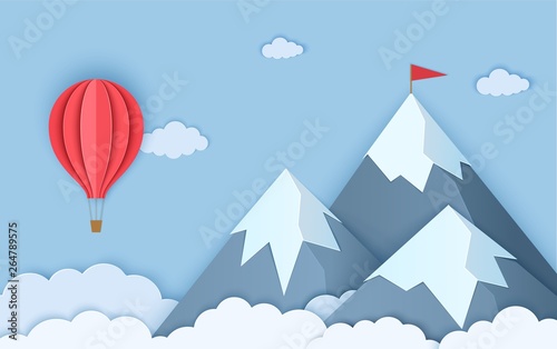 Mountains in paper cut style. Landscape with clouds of three snow capped mountains and a flying red hot air balloon. Vector origami card illustration