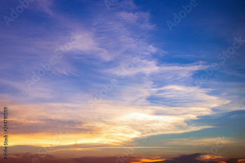 Dramatic sunset sky with beautiful cirrus clouds. © pjjaruwan