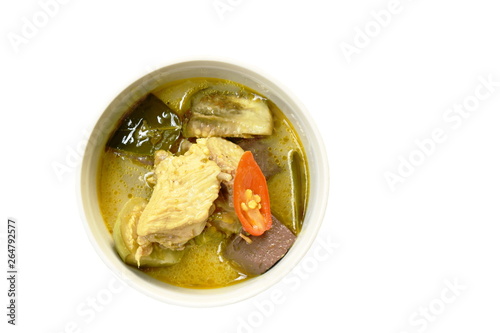boiled chicken with eggplant in green curry on bowl