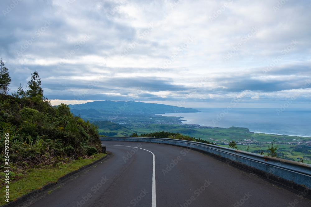 Empty road, with scenic landscape view to Ribeira Grande Coast in Sao Miguel island, Azores, Portugal Empty road, with scenic landscape view to Ribeira Grande Coast in Sao Miguel island, Azores, Portugal