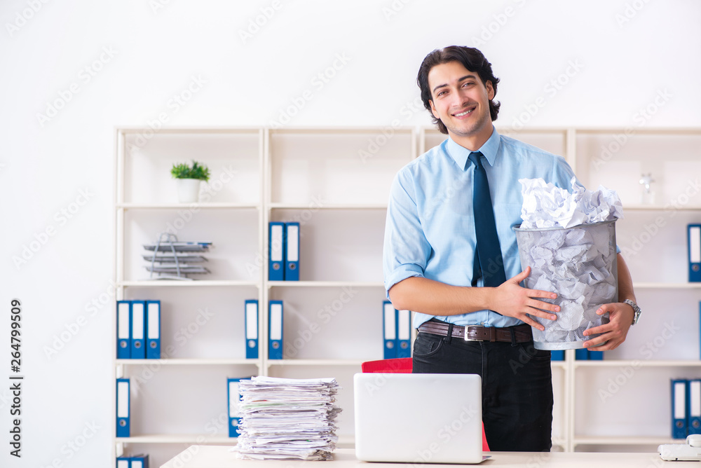 Businessman rejecting new ideas with lots of papers Businessman rejecting new ideas with lots of papers
