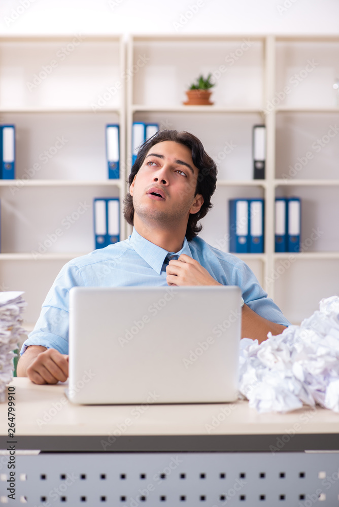 Businessman rejecting new ideas with lots of papers Businessman rejecting new ideas with lots of papers