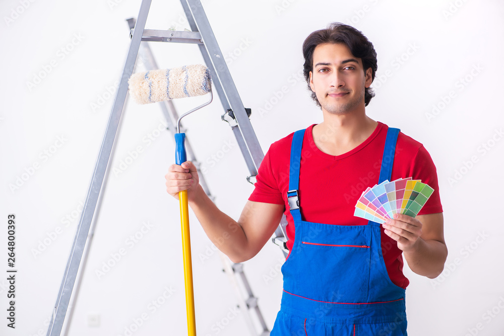 Young handsome contractor working indoors Young handsome contractor working indoors