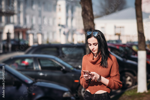 Woman in city street use smartphone © Lazy_Bear