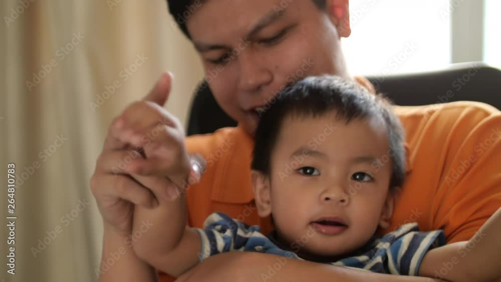Baby boy playing with his father at home Baby boy playing with his father at home