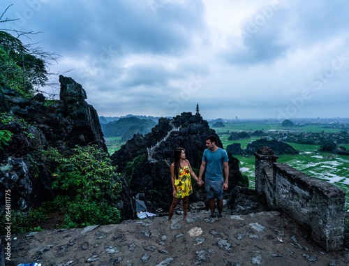 A couple admires the mountains and jungle of northern Vietnam