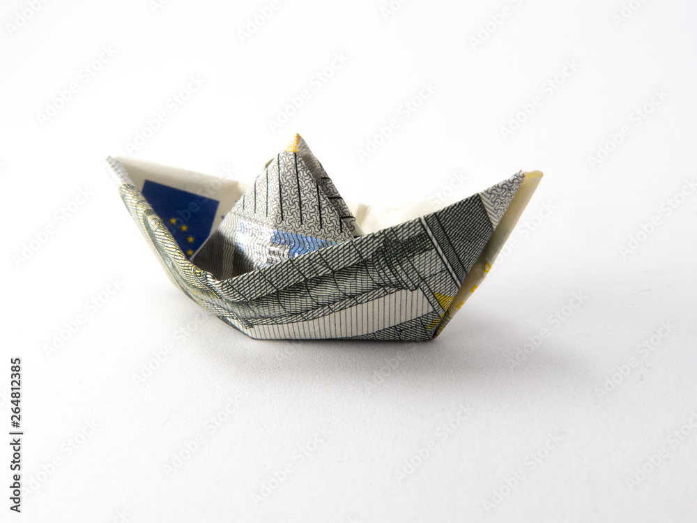Obraz premium Single origami boat made of five euro note isolated on white background