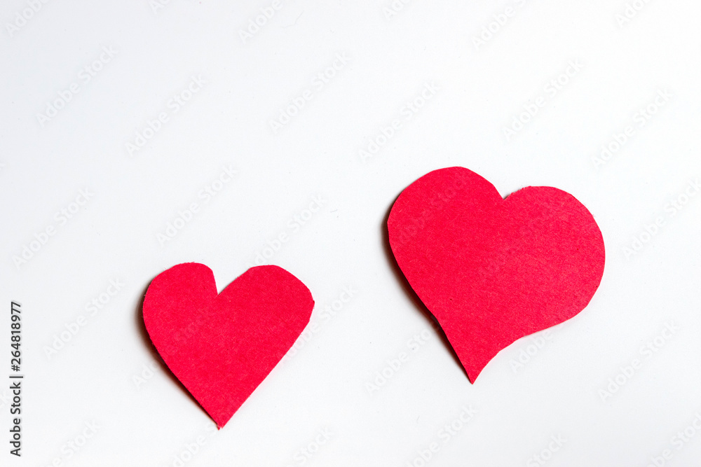 Handmade paper red hearts isolated on white background