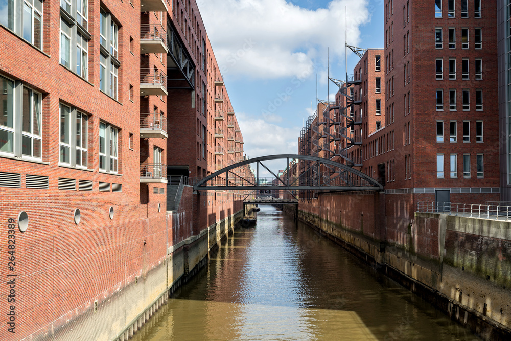 Speicherstadt in Hamburg, Germany. It is the largest warehouse district in the world where the buildings stand on timber-pile foundations and was awarded the status of World Heritage in 2015.