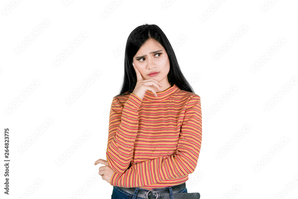 Unhappy woman thinking something on studio Unhappy woman thinking something on studio