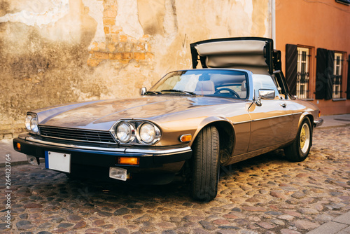 Vintage old classic convertible car on street of old town
