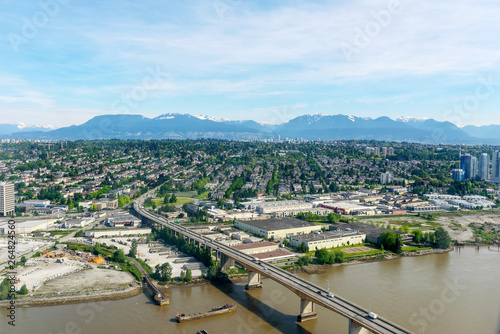 View of Vancouver city and Rock Mountains  from the airplane on clear day, Cityscape, British Columbia, Canada photo