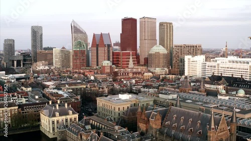 The cityscape of Den Haag in an aerial shot. The drone sinks into the Binnenhof. photo
