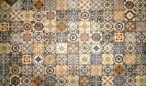 Checkered traditional European ceramic mosaic tile background pattern. Architectural mosaic detail, abstract background for street, bath and pool. Ornamental pattern for street and interior design