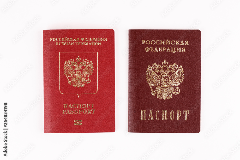 Two Russian passports on white background, closeup shot Two Russian passports on white background, closeup shot