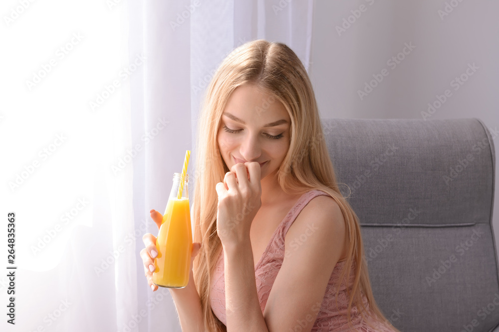 Beautiful young woman drinking fresh juice at home Beautiful young woman drinking fresh juice at home