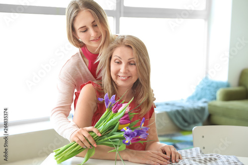 Daughter greeting her mothe...