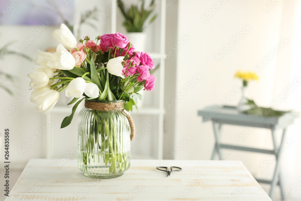 Vase with bouquet of flowers on table Vase with bouquet of flowers on table