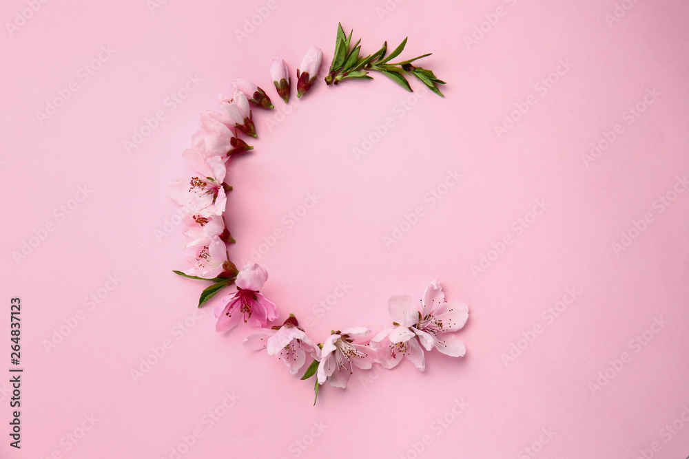 Composition with beautiful blooming branches on color background Composition with beautiful blooming branches on color background