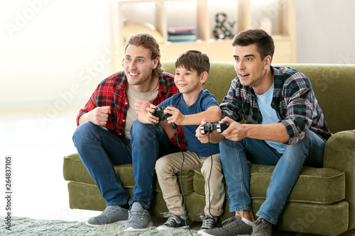 Gay couple with adopted chi...