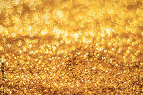 Glitter light abstract gold bokeh blurred background