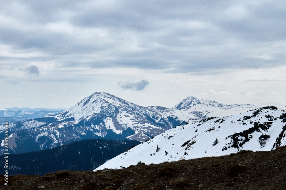 winter landscapes of Ukrainian and Romanian Carpathians ,Snow Mountain with Blue Sky