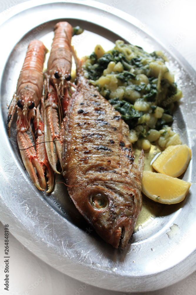 Langoustines grilled and red mullet, sea bass grilled with lemon, potato and Mangel with olive oil. Langoustines grilled and red mullet, sea bass grilled with lemon, potato and Mangel with olive oil.