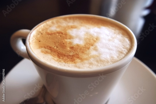 Cappuccino Cup with foam macro photography as background for design.