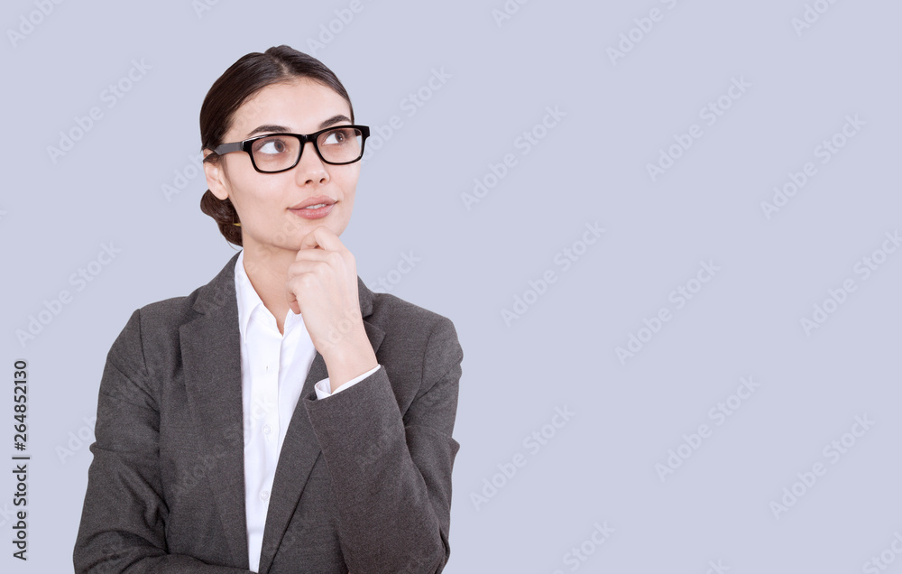 young business woman thinking and looking up 