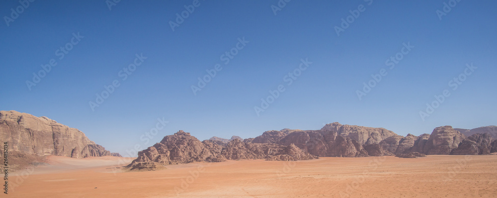 A beautiful day in the Jordanian desert of Wadi Rum. wide dessert with an amazing mountains and sand dunes , amazing scenery that you should see ! A beautiful day in the Jordanian desert of Wadi Rum. wide dessert with an amazing mountains and sand dunes , amazing scenery that you should see !