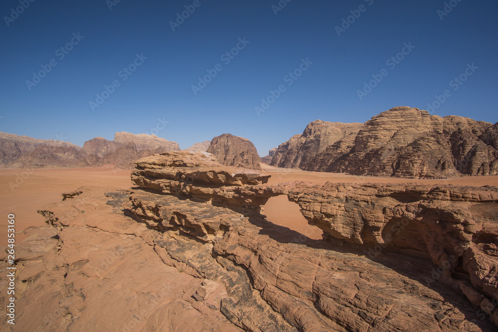 A beautiful day in the Jordanian desert of Wadi Rum. wide dessert with an amazing mountains and sand dunes , amazing scenery that you should see ! 