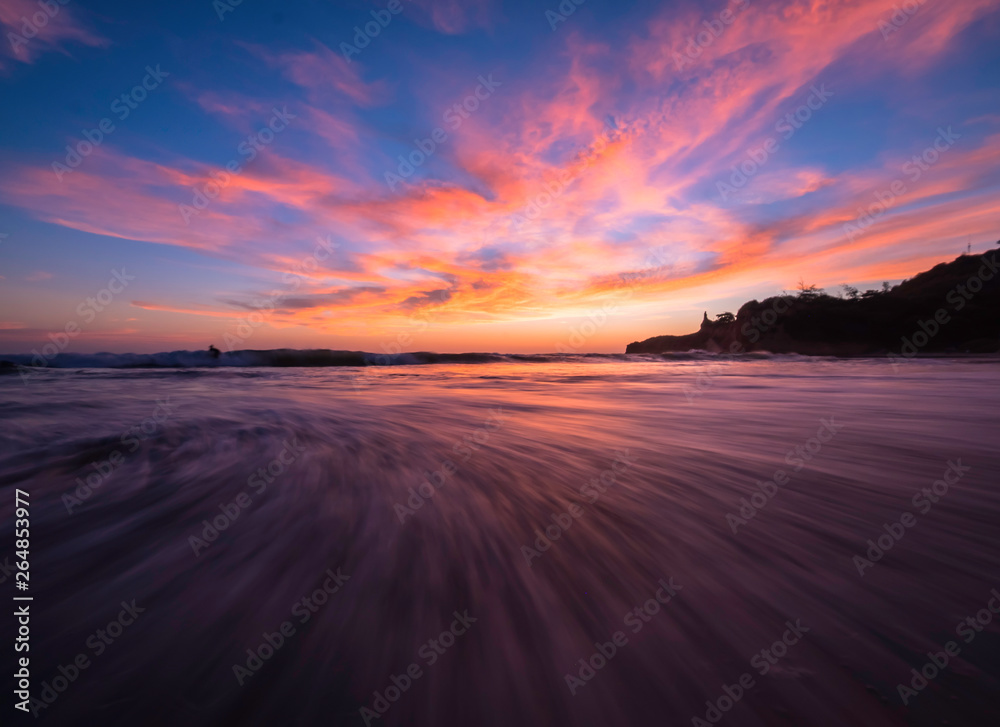 Beautiful sunset scenery on the beach of Montanita Ecuador